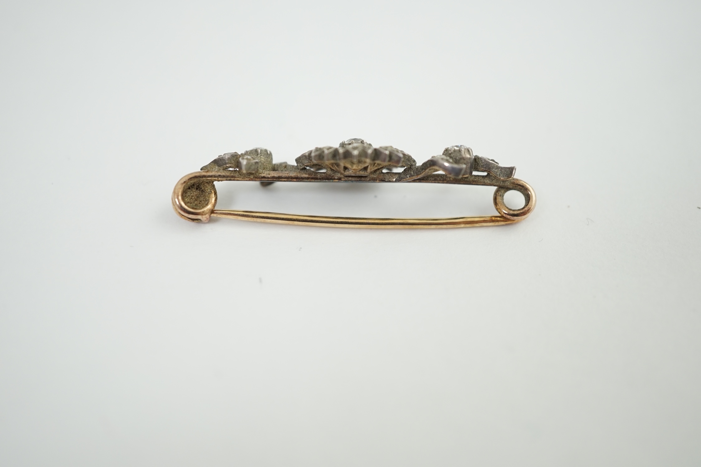 A Victorian gold, silver and diamond flower bar brooch